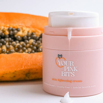 YPB Skin Tone Correcting & Brightening Cream container next to a papaya fruit.