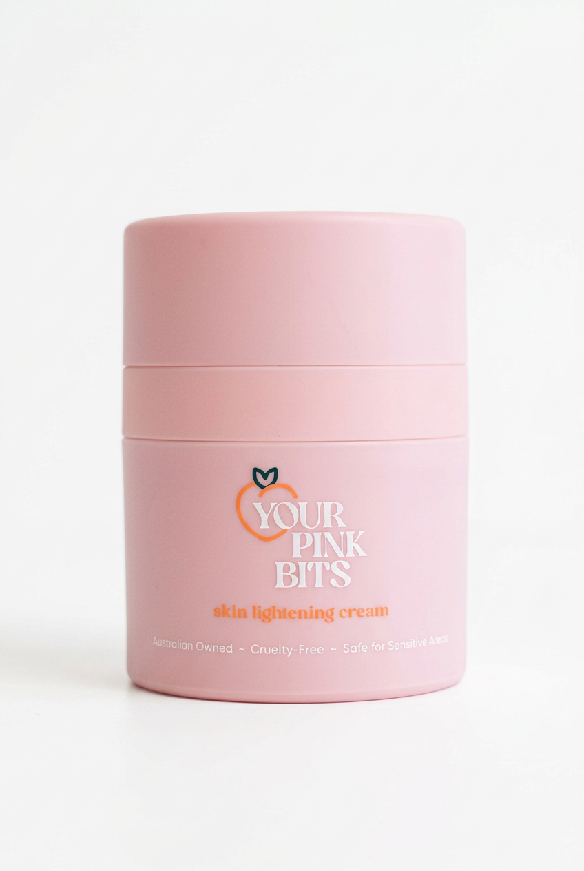 A pink cosmetic jar of Your Pink Bits skin lightening cream, shown on a clean white background.